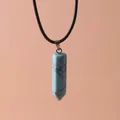 Detail of a blue hexagonal column stone pendant with black leather cord necklace - Teal