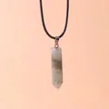 Macro view of a hexagonal prism crystal stone pendant with natural quartz texture - Labradorite