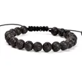 Gedetailleerd overzicht van 8 mm natuurlijke lavastenen op een yoga-armband. - Lavasteen