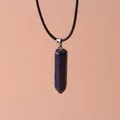 Detail of hexagonal blue goldstone bullet pendant necklace with black cord - Blue Sandstone