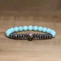 Close-up detail of a gothic skull beaded bracelet with turquoise and hematite stones - Sky Blue