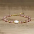 Detail view of a handmade bracelet with a baroque pearl and pink natural stone beads - Berry Red