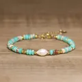 Detailed view of a handmade baroque pearl and turquoise stone beaded bracelet for women. - Cyan Blue