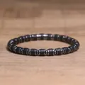 Men's hematite beaded bracelet with cylinder spacers on a wooden background - Matte Agate Style (25)