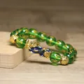 Détails d'un bracelet de richesse Pi Xiu en perles vertes avec mantra à six syllabes - Perles Mantra Vert Émeraude Translucides (9)