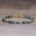 Detailed macro view of geometric turquoise natural stone and gold Tila bead bracelet - Tila Bracelet (2)