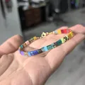Kleurrijke TILA-kralenarmband met gouden sluiting en geometrisch natuurstenen ontwerp - Meerkleurige Marmerstructuur Splicing Stijl (13)