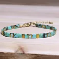 Elegant turquoise Tila bead bracelet featuring golden geometric metal spacers on wood - Light Blue Marble Gold Spacer Style (17)