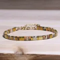 Elegant TILA bead bracelet featuring natural stone patterns and gold geometric accents. - Beige-Brown Geometric Patchwork Style (22)