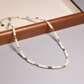 Elegant handmade white beaded necklace with colorful accents and gold extender chain - Maillard Bohemian Beaded Style (XL0032)