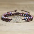 Close-up of a double-layered braided bracelet with colorful jasper beads and heart charm - Purple