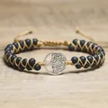 Close-up of silver tree of life charm and black lava beads on woven cord - Tree of Life Style / Volcano