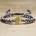 Close-up of handmade double-layer African pine bead bracelet with Tree of Life charm - Tree of Life Style / Gray