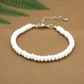 Adjustable white natural stone beaded bracelet with metal lobster clasp and extension chain - White Plastic Beads