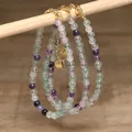Detail view of handmade natural green aventurine and white turquoise beaded necklaces - Bright Purple