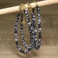 Close-up of snowflake obsidian beaded bracelets with stainless steel lobster clasp - Black and White