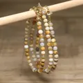 Detailed view of handmade natural stone beaded necklaces with gold extension chain. - Turmeric