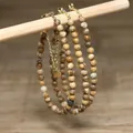 Detailed close-up showing natural stone beads and gold-plated adjustable extender chain. - Earthy Yellow