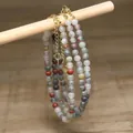 Close-up of handmade natural green aventurine and white turquoise beaded necklaces. - Light Green