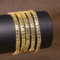 Detail view of yellow Tila beaded bracelets on a black display stand - Yellow (TLSL-009)