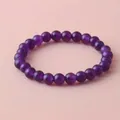 Detailed close-up of 8mm purple amethyst healing stone beaded elastic bracelet - 8 mm / Purple Jade