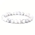 Detailed close-up of 8mm white howlite beaded bracelet with black marble marble texture - 8 mm / Howlite