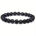 Macro detail showing 8mm black marble stone beads on elastic healing bracelet strand - 8 mm / Turquoise Blue