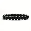 Close-up macro detail of a glossy 8mm black obsidian beaded elastic healing bracelet. - 8 mm / Bright Black