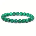 Close-up detail of 8mm green malachite stone beads on a stretch elastic healing bracelet - 8 mm / Chrysocolla