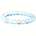 Detailed view of 8mm iridescent blue glow healing stone beads on elastic bracelet - 8 mm / Opal