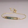 Detailed close-up of a gold-plated adjustable bracelet with colorful natural stone beads. - Seven Color Gradient Natural Stone