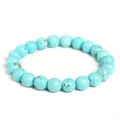 Macro detail of an 8mm blue turquoise-style healing stone beaded elastic bracelet - 8 mm / Blue Turquoise