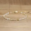 Detailed view of faceted natural stone beads and gold-tone lobster clasp on bracelet - Champagne