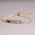 Detail of gold plated slider bracelet with multi-color natural stone beads - Dark Blue and Moonstone Style