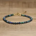 Close-up of faceted African pine stone beads on a dainty adjustable gold bracelet. - Cyan