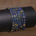 Handmade TILA tile bead bracelet featuring blue mottled natural stones and gold metal spacers - Dark Blue (TLSL-004)