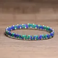 Handgemaakte elastische kralenarmband met blauwe en groene tegels en gouden kralen - Phoenix Steen