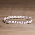 Modieuze elastische armband met geometrische marmeren kralen en kleine gouden bollen - Witte Turkoois