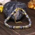 Elegante verstelbare roestvrijstalen armband met natuurlijke grijze steenkralen design - Zwarte Flits