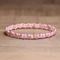 Stylish pink handmade elastic beaded bracelet featuring elegant gold accents for daily wear - Pink Imperial Stone