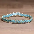 Handmade turquoise and gold beaded elastic bracelet with unique zig-zag pattern design - Square Turquoise with Black Veins