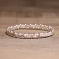 Handmade pink stone beaded elastic bracelet with gold accents for men and women - Red Network Stone