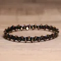 Handmade elastic hematite beaded bracelet with black and bronze geometric beads for men - Shiny Black Agate