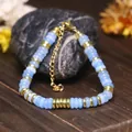 Bracciale regolabile da donna con perle abaco blu chiaro e distanziatori in acciaio dorato - Acquamarina