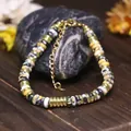 Squisito bracciale di perline regolabile fatto a mano con perle piatte fantasia e oro - Minerale Pavone Giallo