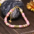 Bracciale regolabile in pietra naturale rosa e perline in acciaio dorato - Grana di Legno Rosso
