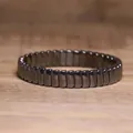 Macro detail of metallic hematite stone bracelet with elastic cord - Rounded Facet Style (#5)