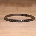 Detailed macro view of a black hematite elastic bracelet with pyramid stud design - Pyramid Point Style (#7)