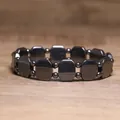 Close-up of a hematite bracelet with octagonal metallic beads on a wood surface - Octagon Geometric Combo Style (#14)