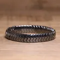 Detailed macro view of black hematite chevron-shaped links on a stylish elastic bracelet. - V-Shape Mirror Texture Style (#19)